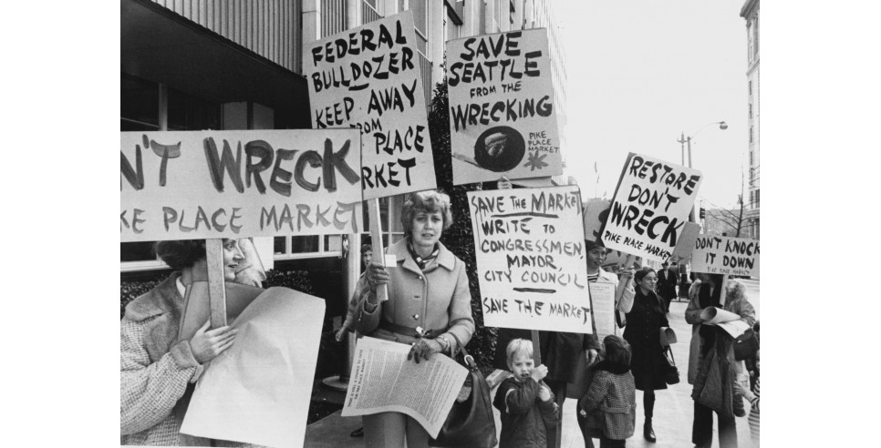 Sign-carrying members of the Friends of the Market picketed City Hall in February 1971 to protest the proposed Pike Plaza urban-renewal project for Pike Place Market. (Richard S. Heyza / The Seattle Times, 1971) Sign-carrying members of the Friends of the Market picketed City Hall in February 1971 to protest the proposed Pike Plaza urban-renewal project for Pike Place Market. (Richard S. Heyza / The Seattle Times, 1971)